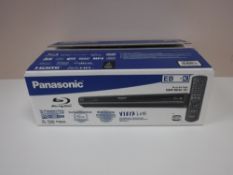 A boxed Panasonic Blu Ray player with remote