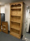 A tall pine bookcase,