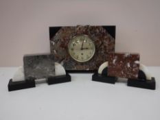 A three piece Art Deco marble clock garniture with key