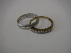 A 9ct white gold wedding band,