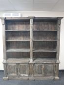 A large set of rustic pine open bookshelves,