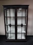 An early twentieth century mahogany double glazed door display cabinet