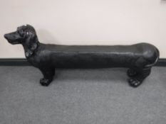 A fibreglass garden seat in the form of a dachshund