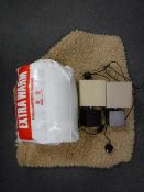 A contemporary rug together with a three way floor lamp,