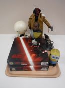 A tray containing two boxed Star Wars collectors plates, an unboxed Sideshow Collectibles Hellboy,