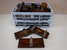 A box of vintage tie presses