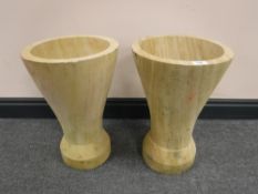 A pair of sandstone vases or planters