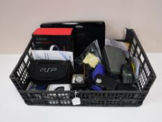 A box containing an Humax Freeview box with remote, smartwatch, gents wristwatches, Diskmans,