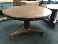 A circular Victorian mahogany breakfast table