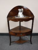 A Georgian mahogany corner washstand together with a china jug and basin
