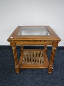 A New England two tier glass topped lamp table