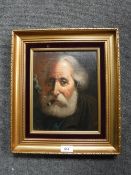 A gilt framed oil on canvas - Gentleman smoking a cigar,