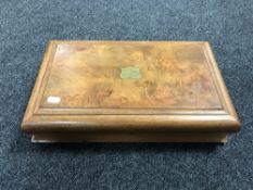 An antique walnut canteen containing miscellaneous cutlery