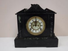 An antique slate mantel clock
