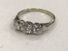 An 18ct gold three stone diamond ring, approximately 1.