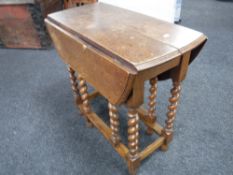 An oak barley twist gate leg table