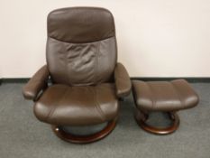 A brown leather Ekornes 'Stressless' swivel relaxer chair with footstool