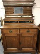 A late Victorian oak snooker score board cabinet, the score board area above cupboard base,