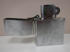 An oversized table lighter in the form of a Zippo