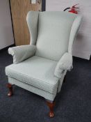 A Parker Knoll wingback armchair