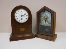 An inlaid mahogany domed topped mantel clock with enamelled dial retailed by Walker & Hall,