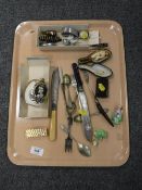 A tray of hat pins, cutlery, china dolly tops, Dunhill lighters, snuff box,