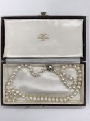 A large strap of pearls with pearl and diamond clasp