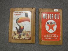 A metal Guinness advertisement mounted on pine board and a Texaco advertisement mounted on pine