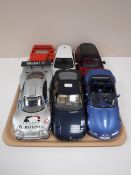 A tray containing six large scale die cast vehicles, including Maisto, Burago, sportscars, Ferraris,