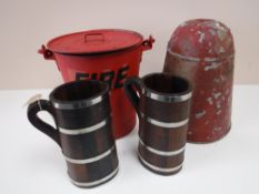 A pair of metal fire buckets,