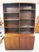 A Danish rosewood bookcase fitted with cupboards