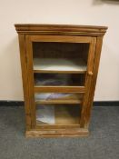 A pine glazed door display cabinet,