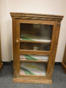 A pine glazed door display cabinet,