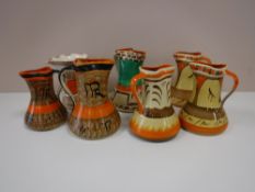 Seven Myott hand painted jugs