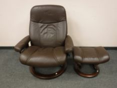 A brown leather Ekornes 'Stressless' swivel relaxer chair with footstool