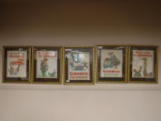 A set of six gilt framed Guinness advertising prints