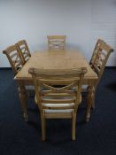 A contemporary extending dining table with leaf and six dining chairs