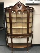 A good quality Georgian style mahogany display cabinet raised on pad feet with under-stretcher,