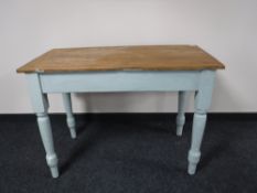 An antique pine flap sided table with painted legs