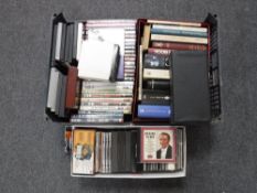 A crate and two boxes of DVDs,