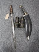 A World War I bayonet together with a Kukri knife in leather sheathe and a pair of early twentieth