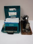 A cased Hexagon vintage sewing machine together with a cased Olivetti Studio 45 typewriter