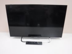 A Sony KDL-32W653A television and remote
