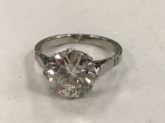 A fine quality platinum solitaire diamond ring, the brilliant cut stone weighing an estimated 2.