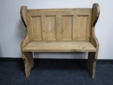 A reclaimed pine pew,