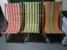 Four mid 20th century folding deck chairs