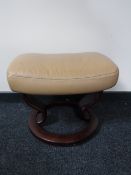 A contemporary leather footstool