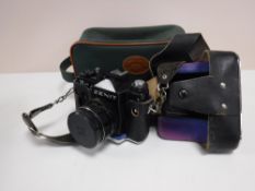 A Zenit 12 XP camera and lens in bag