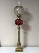 An antique brass Corinthian column oil lamp with chimney and shade CONDITION REPORT: