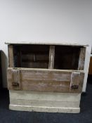 An antique pine feed bin